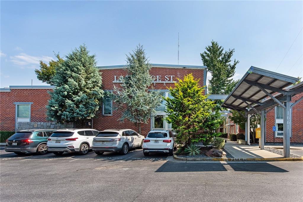 1661 La France Street Northeast, Unit 325 Atlanta, GA 30307 - Photo 1 of 40 a view of a cars parked in front of a house