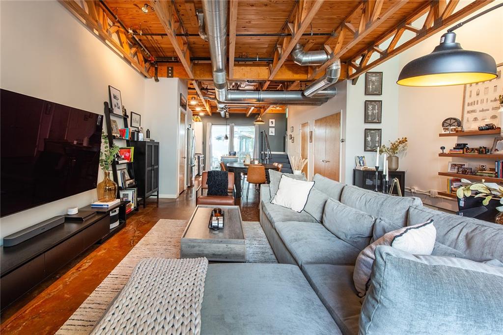 1661 La France Street Northeast, Unit 325 Atlanta, GA 30307 - Photo 12 of 40 a living room with furniture and a flat screen tv