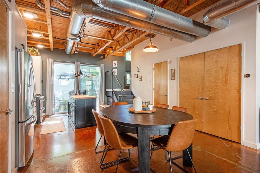 1661 La France Street Northeast, Unit 325 Atlanta, GA 30307 - Photo 16 of 40 a view of a dining room with furniture and wooden floor