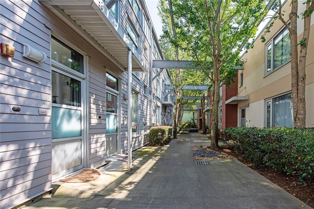 1661 La France Street Northeast, Unit 325 Atlanta, GA 30307 - Photo 2 of 40 a building with trees in front of it