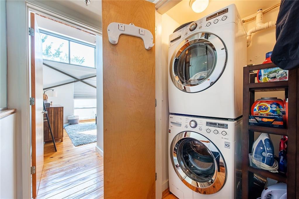 1661 La France Street Northeast, Unit 325 Atlanta, GA 30307 - Photo 24 of 40 a view of a hallway with washer and dryer