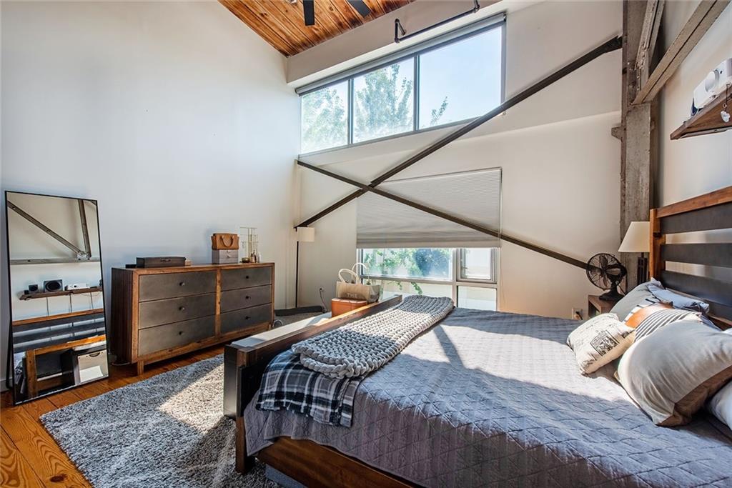 1661 La France Street Northeast, Unit 325 Atlanta, GA 30307 - Photo 27 of 40 a view of a bedroom with furniture and a window