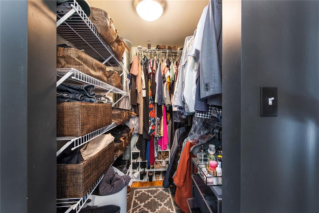 1661 La France Street Northeast, Unit 325 Atlanta, GA 30307 - Photo 29 of 40 a view of walk in closet with clothes