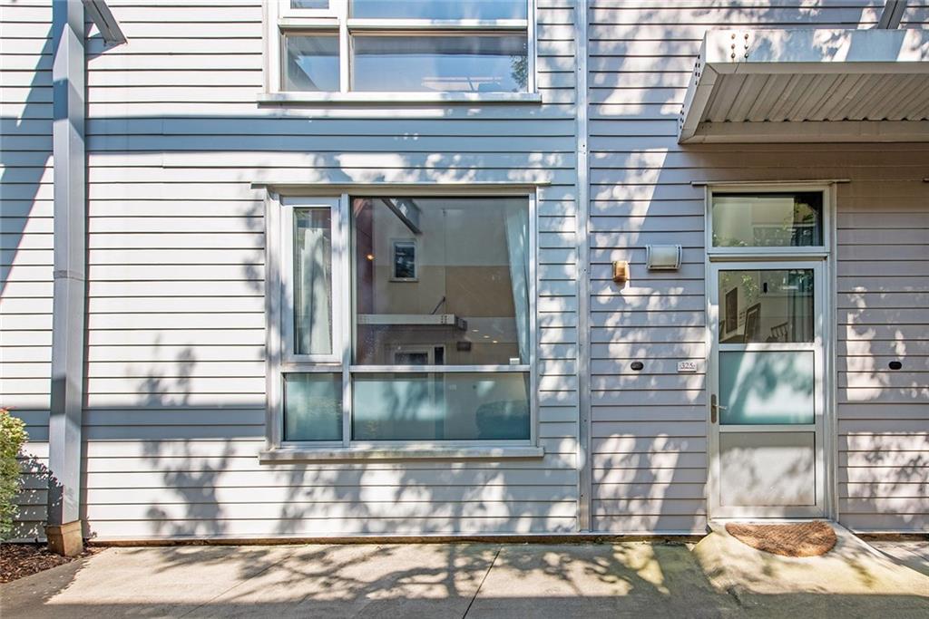 1661 La France Street Northeast, Unit 325 Atlanta, GA 30307 - Photo 3 of 40 a view of a brick building with a window