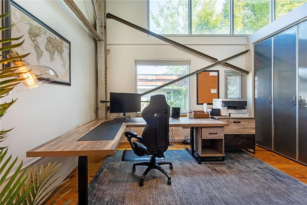 1661 La France Street Northeast, Unit 325 Atlanta, GA 30307 - Photo 31 of 40 a view of a workspace with furniture and a window