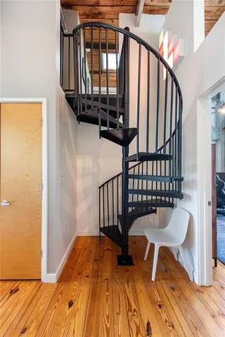 a view of balcony with wooden floor and furniture