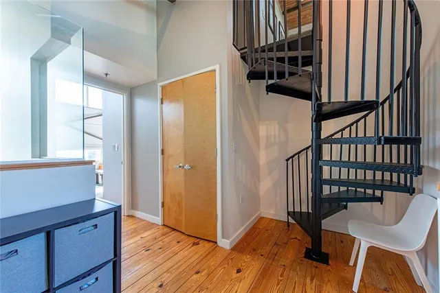 a view of entryway with wooden floor and stairs