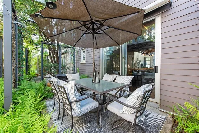a patio with a patio table and chairs