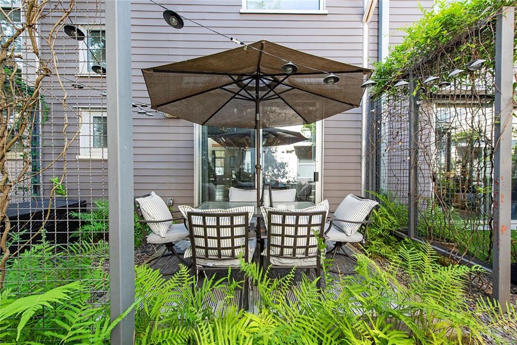 1661 La France Street Northeast, Unit 325 Atlanta, GA 30307 - Photo 38 of 40 a view of a chair and table in the patio