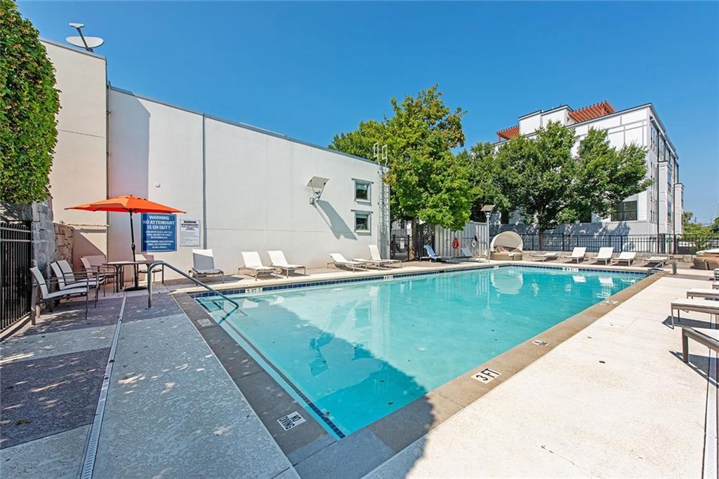 1661 La France Street Northeast, Unit 325 Atlanta, GA 30307 - Photo 39 of 40 a view of a swimming pool with a lounge chairs