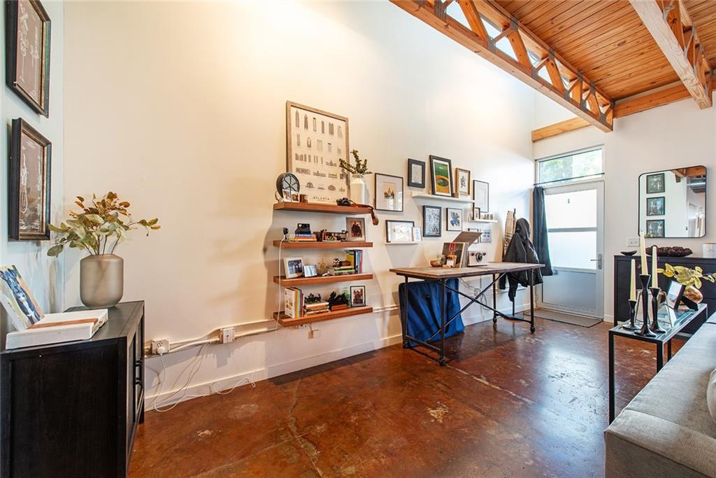 1661 La France Street Northeast, Unit 325 Atlanta, GA 30307 - Photo 7 of 40 a living room with furniture and wooden floor