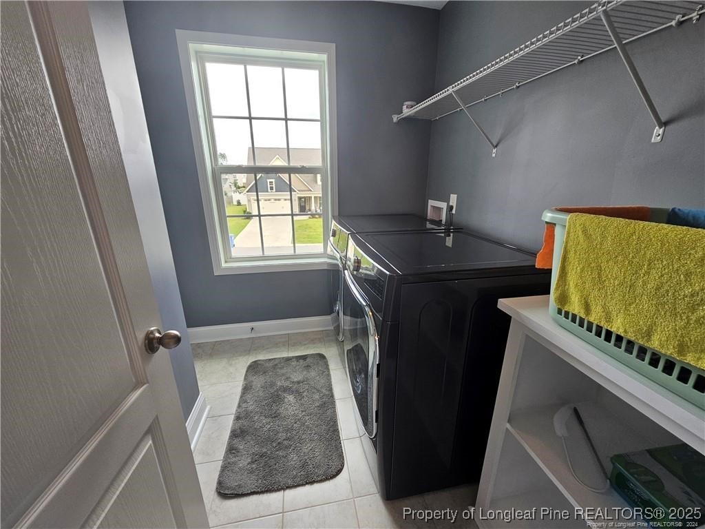 181 Pendleton Street Raeford, NC 28376 - Photo 13 of 19 a bathroom with a granite countertop sink a toilet and a window