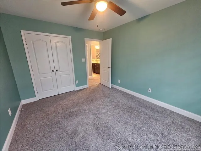 an empty room with closet area