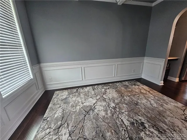 a view of a closet with wooden floor