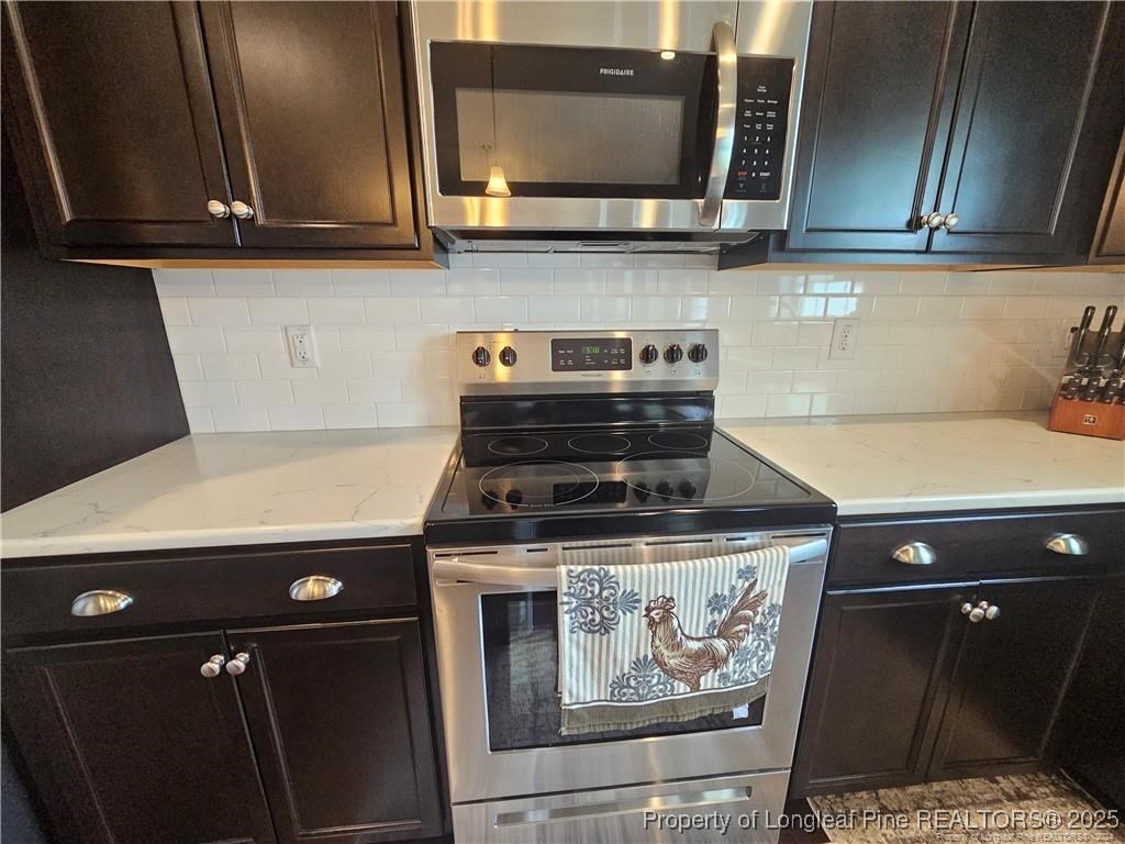 181 Pendleton Street Raeford, NC 28376 - Photo 6 of 19 a stove top oven sitting inside of a kitchen