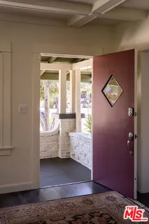 a view of an entryway with wooden floor