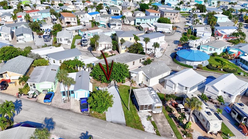 10725 South Ocean Drive, Unit 82 Jensen Beach, FL 34957 - Photo 2 of 13 an aerial view of residential houses with outdoor space