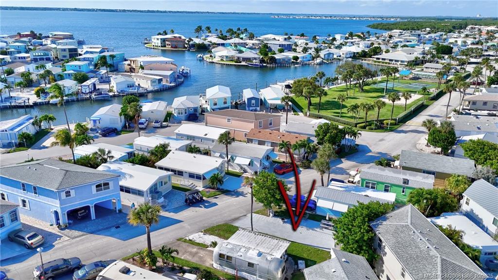 10725 South Ocean Drive, Unit 82 Jensen Beach, FL 34957 - Photo 3 of 13 an aerial view of a houses with outdoor space