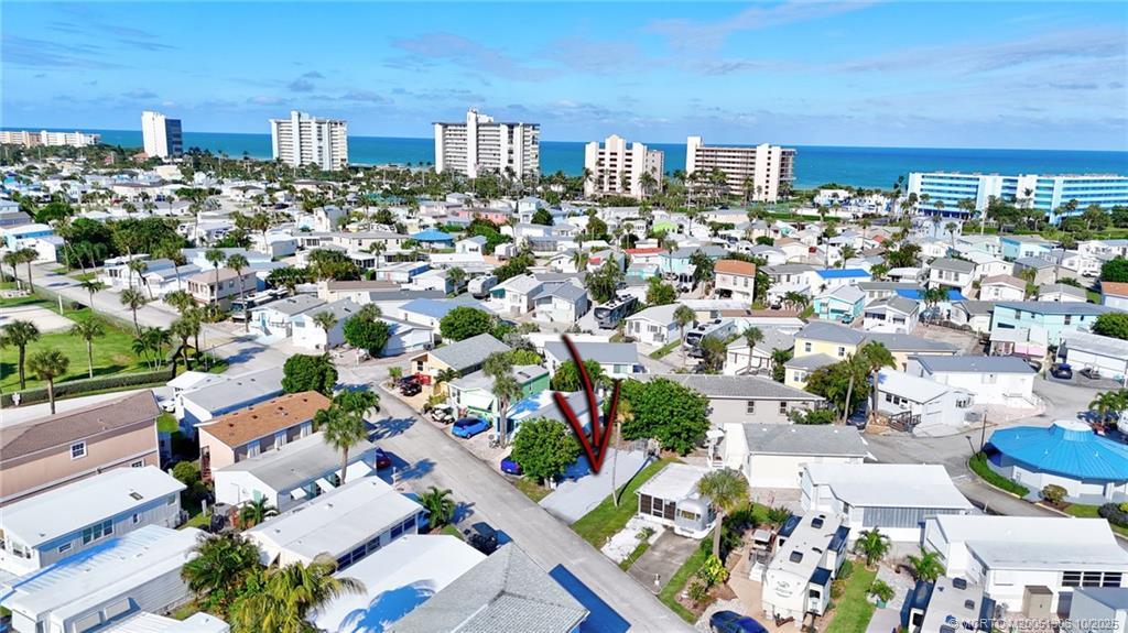 10725 South Ocean Drive, Unit 82 Jensen Beach, FL 34957 - Photo 5 of 13 an aerial view of a city with lots of residential buildings