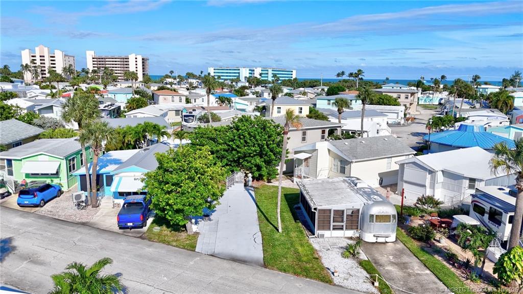 10725 South Ocean Drive, Unit 82 Jensen Beach, FL 34957 - Photo 6 of 13 an aerial view of a city