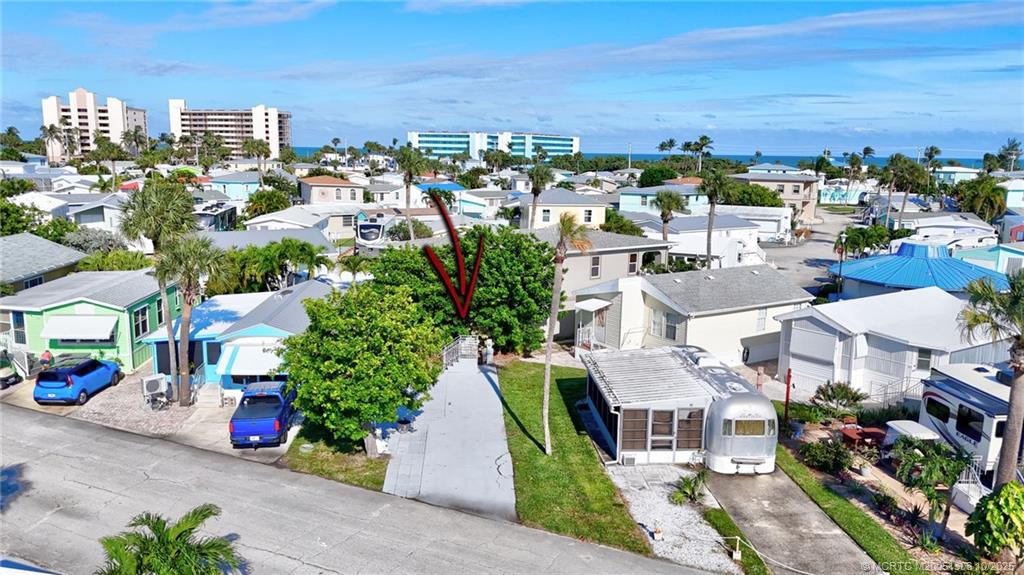 10725 South Ocean Drive, Unit 82 Jensen Beach, FL 34957 - Photo 7 of 13 an aerial view of a city