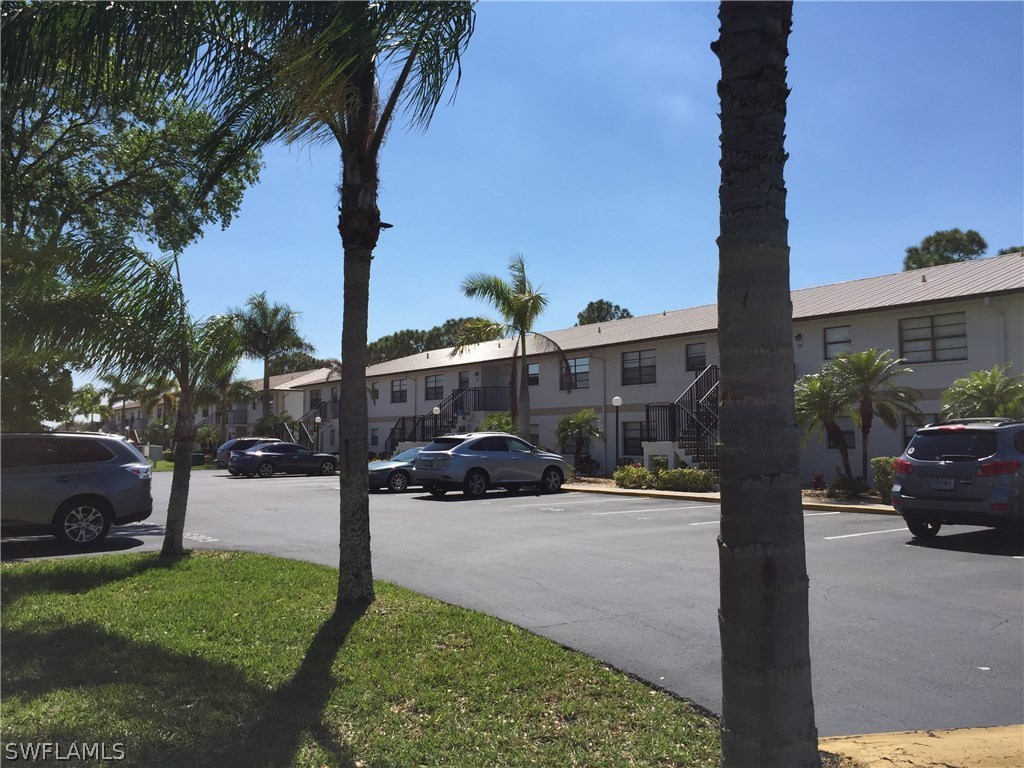 26485 Rampart Boulevard, Unit E3 Punta Gorda, FL 33983 - Photo 1 of 22 a view of outdoor space with garden