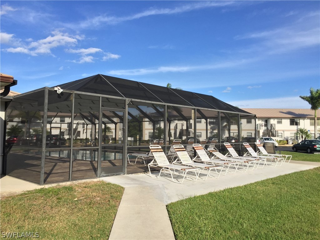 26485 Rampart Boulevard, Unit E3 Punta Gorda, FL 33983 - Photo 21 of 22 a view of a swimming pool with a patio