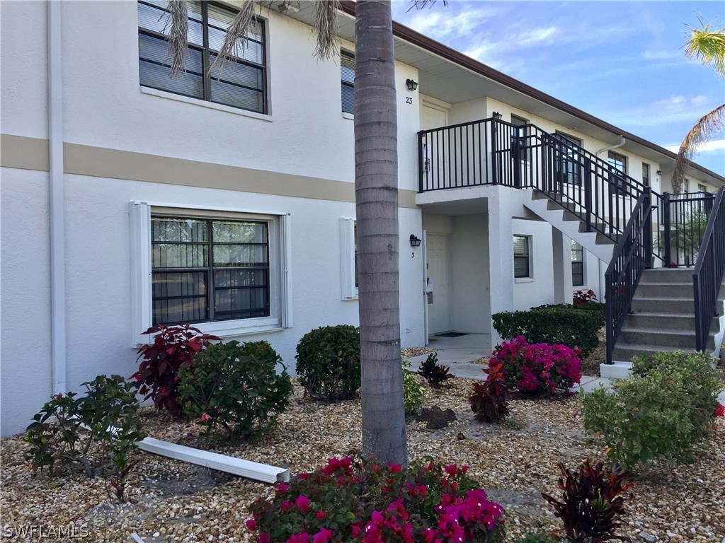 26485 Rampart Boulevard, Unit E3 Punta Gorda, FL 33983 - Photo 6 of 22 a front view of a house