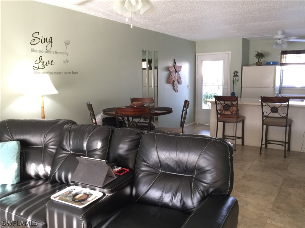 26485 Rampart Boulevard, Unit E3 Punta Gorda, FL 33983 - Photo 10 of 22 a living room with furniture