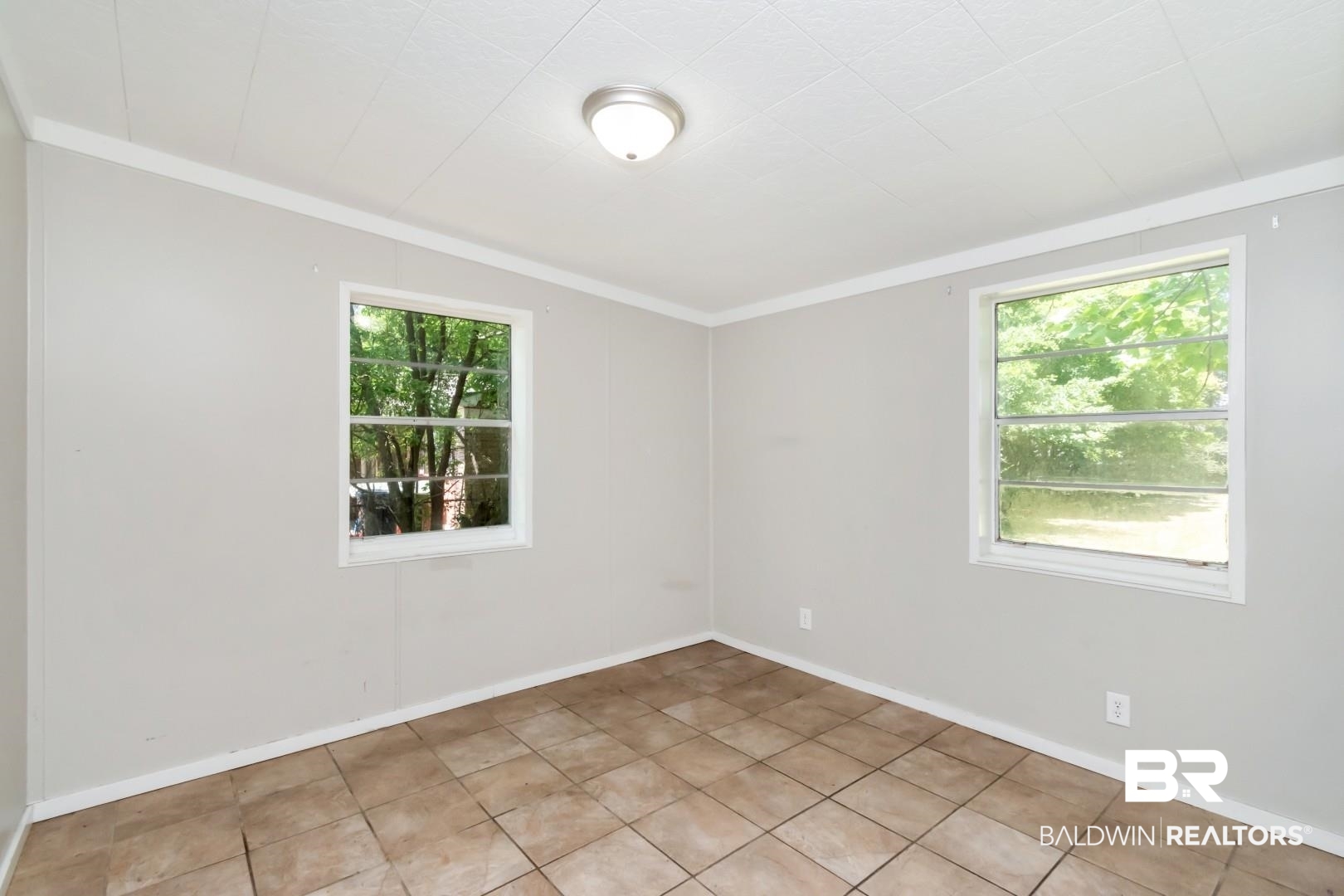5650 Alice Drive Theodore, AL 36582 - Photo 12 of 15 Unfurnished room with baseboards and crown molding