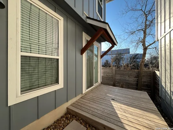 a view of backyard with a deck