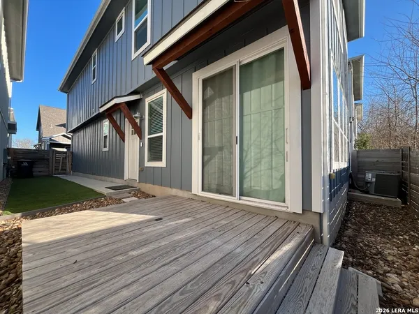 a view of a house with backyard and porch