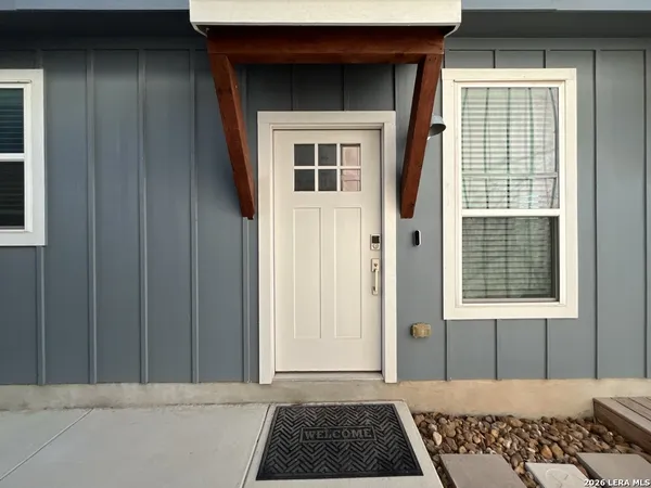 a view of a door and a window