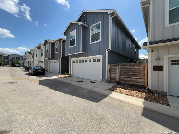a view of a house with a snow in the road