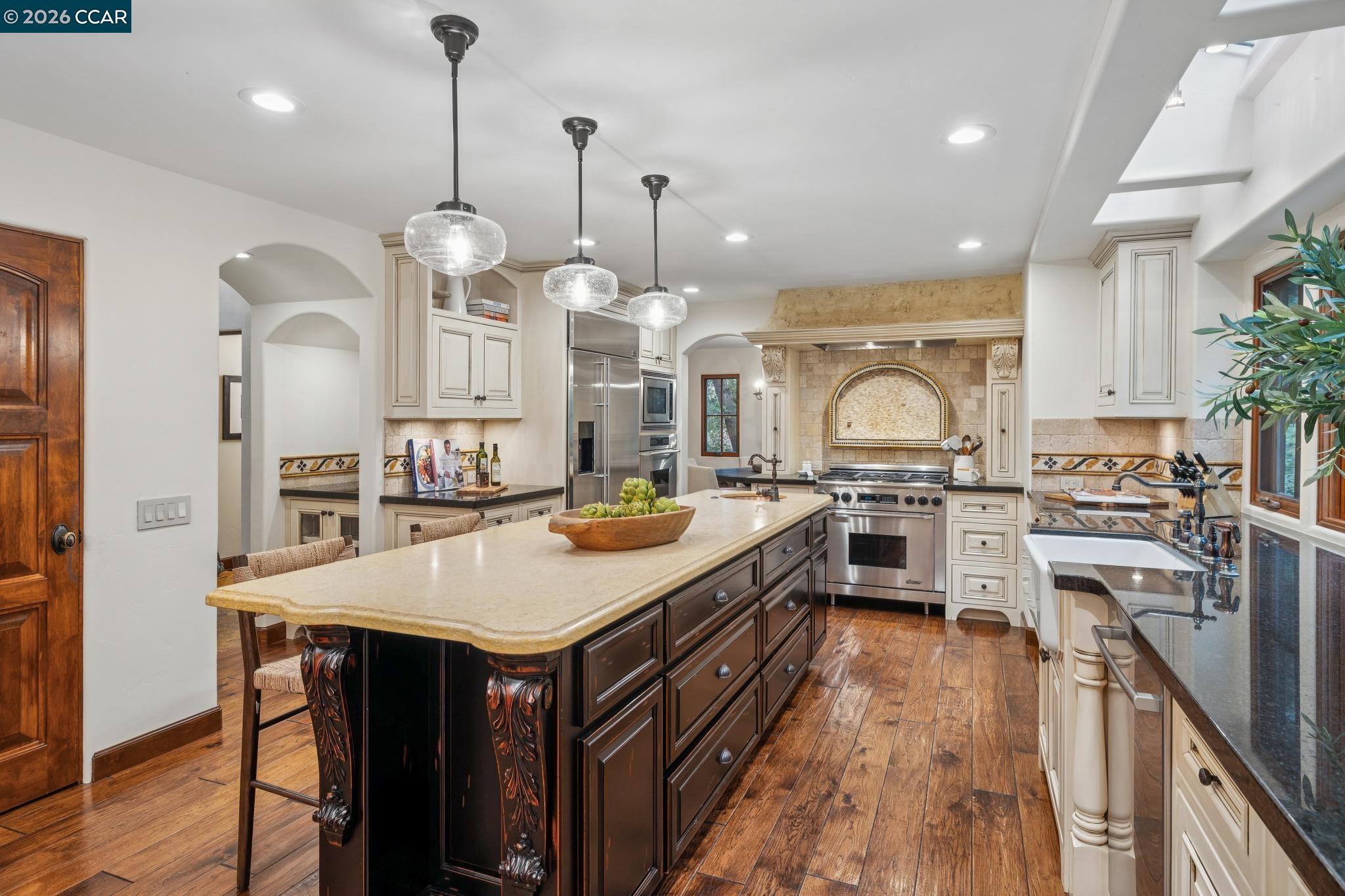 1324 A Martino Road Lafayette, CA 94549 - Photo 11 of 55 a large kitchen with a stove a sink a center island and wooden floor