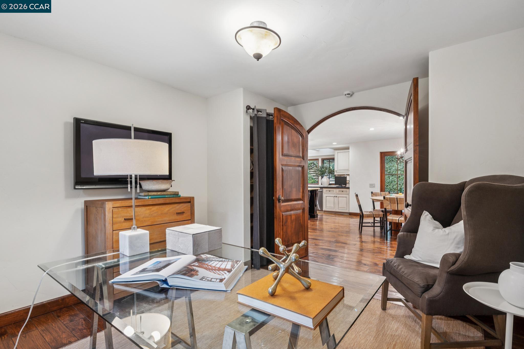 1324 A Martino Road Lafayette, CA 94549 - Photo 19 of 55 a living room with furniture a rug and a flat screen tv