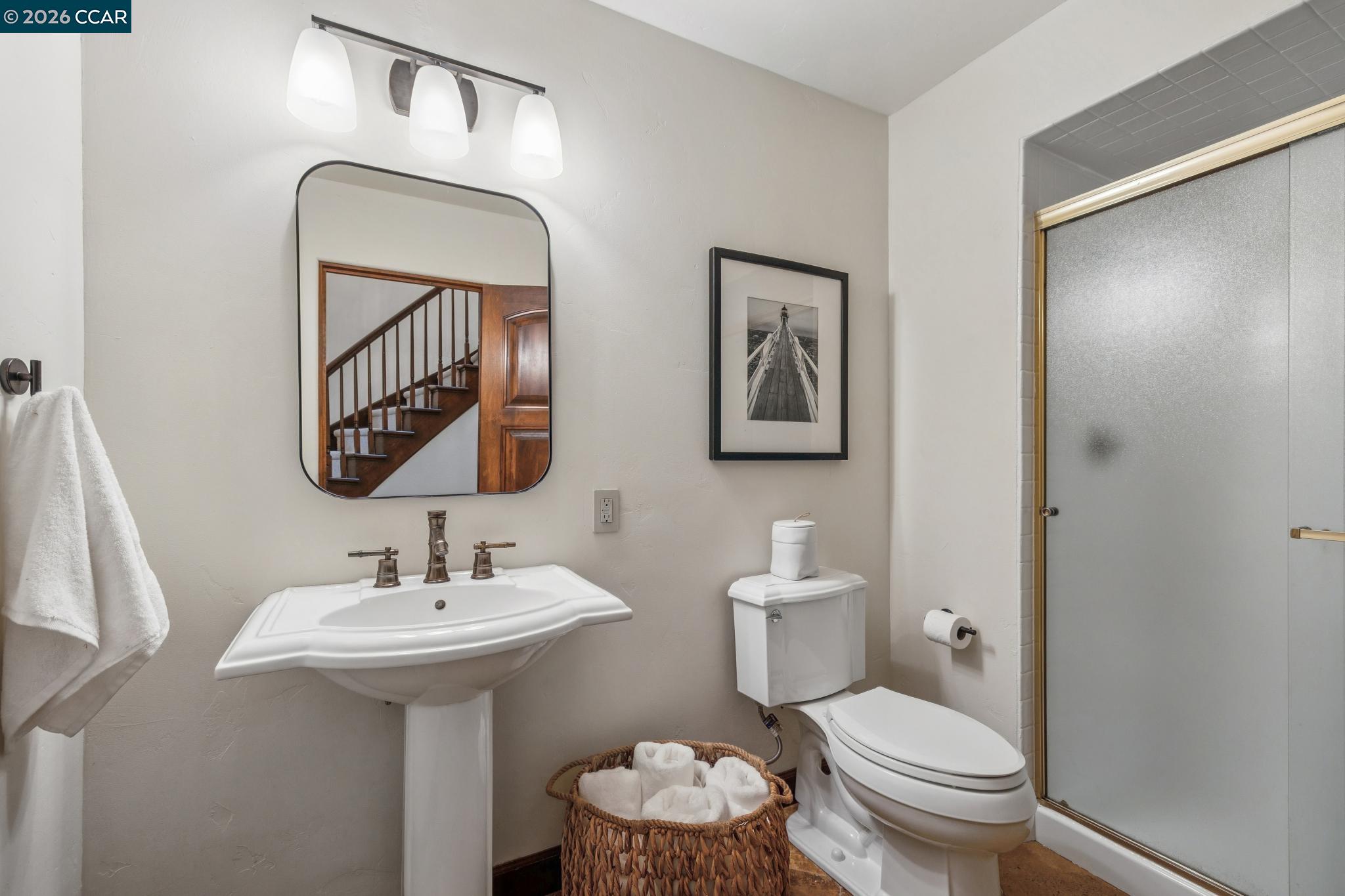 1324 A Martino Road Lafayette, CA 94549 - Photo 23 of 55 a bathroom with a toilet sink and mirror