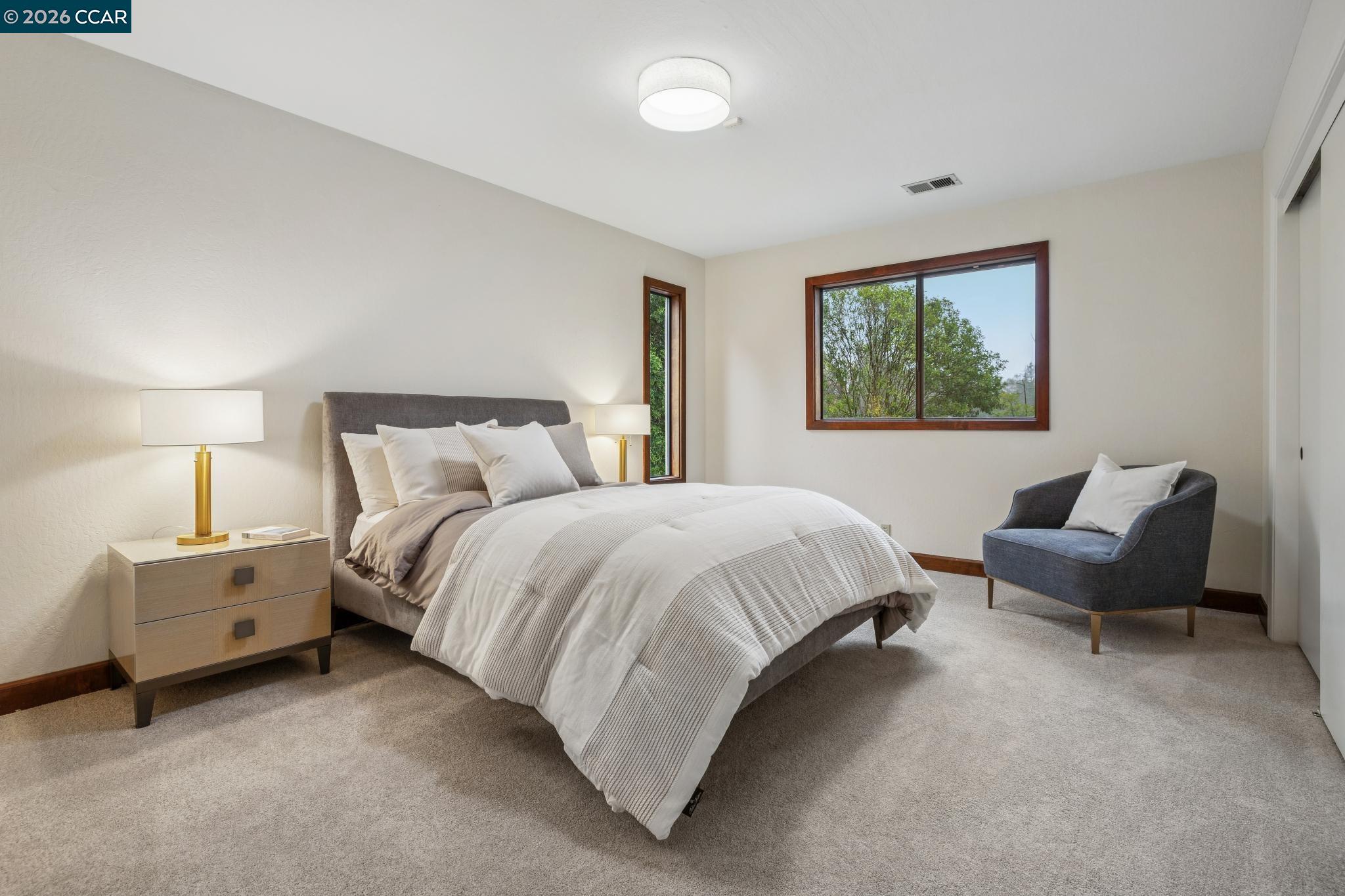 1324 A Martino Road Lafayette, CA 94549 - Photo 32 of 55 a spacious bedroom with a bed and a couch