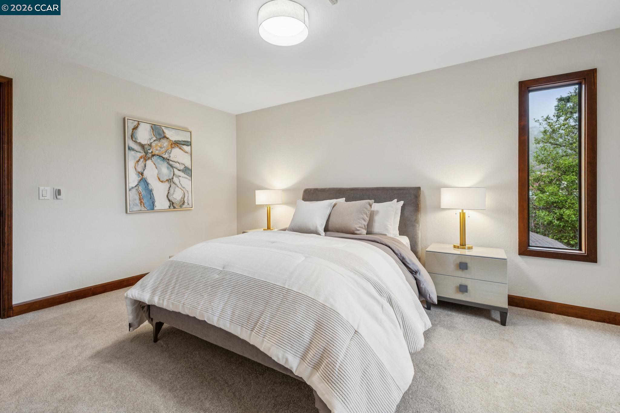 1324 A Martino Road Lafayette, CA 94549 - Photo 33 of 55 a bedroom with a bed and a lamp on dresser