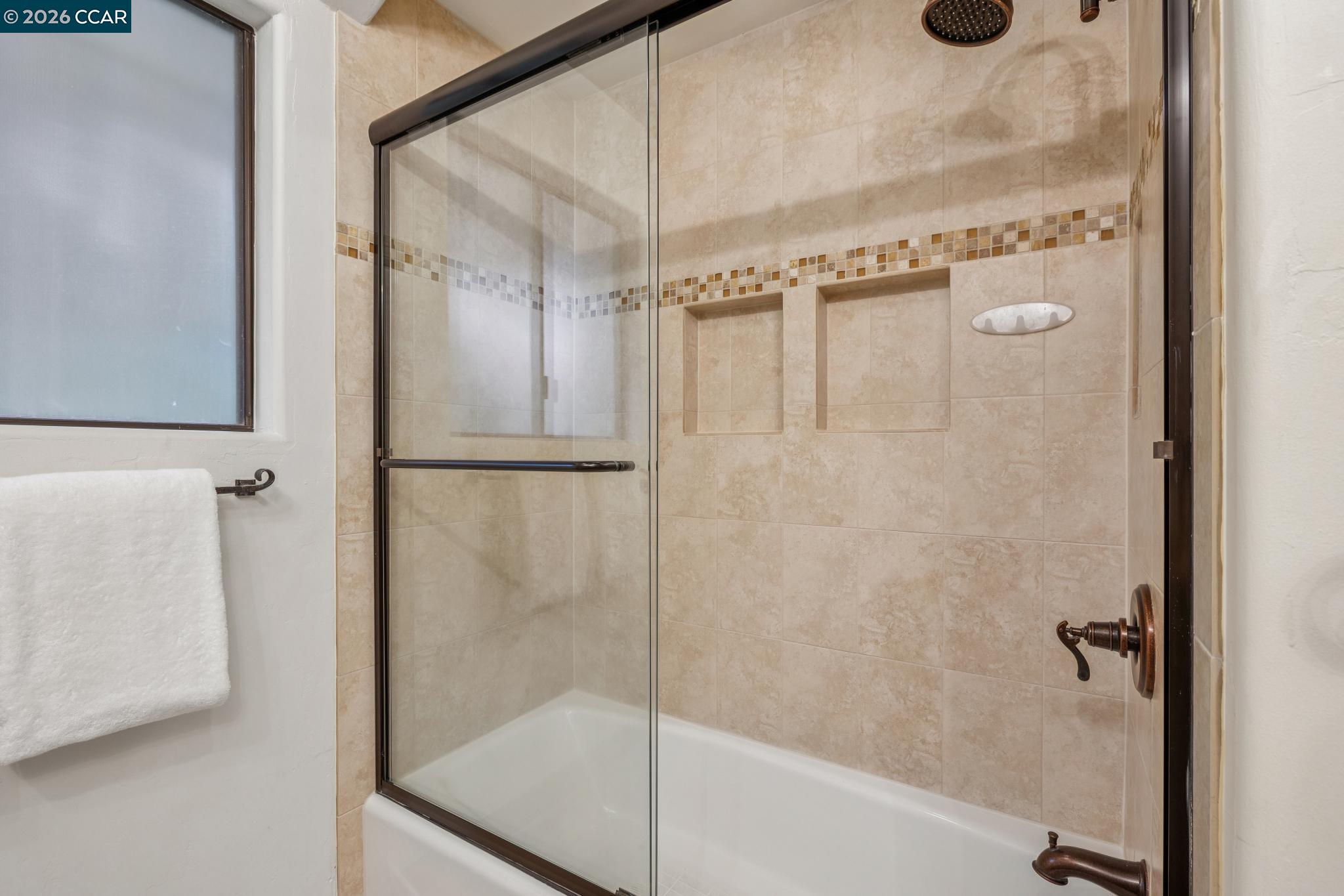 1324 A Martino Road Lafayette, CA 94549 - Photo 37 of 55 a bathroom with a glass shower door