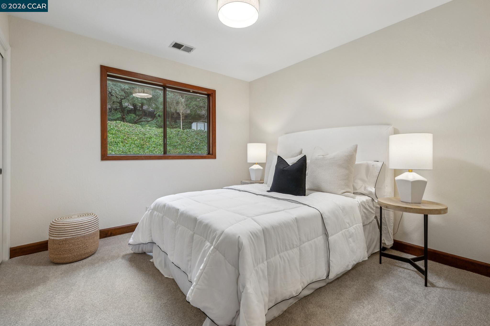 1324 A Martino Road Lafayette, CA 94549 - Photo 38 of 55 a bedroom with a bed and a window