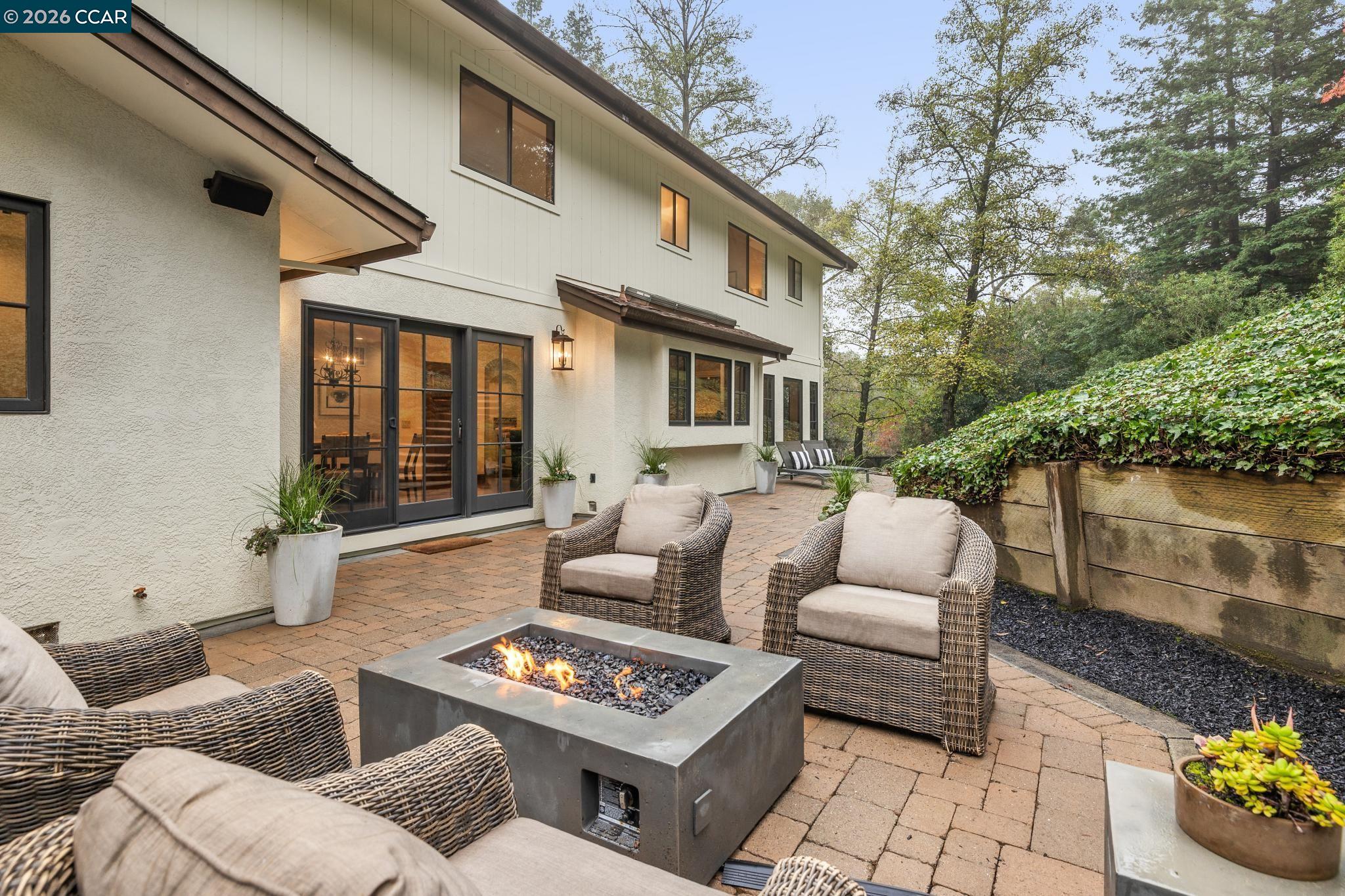 1324 A Martino Road Lafayette, CA 94549 - Photo 43 of 55 a view of a patio with couches table and chairs with potted plants