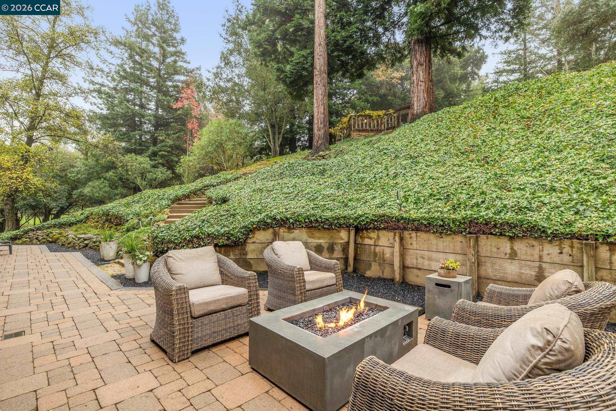 1324 A Martino Road Lafayette, CA 94549 - Photo 44 of 55 a view of a patio with couches and a table and chairs with wooden floor
