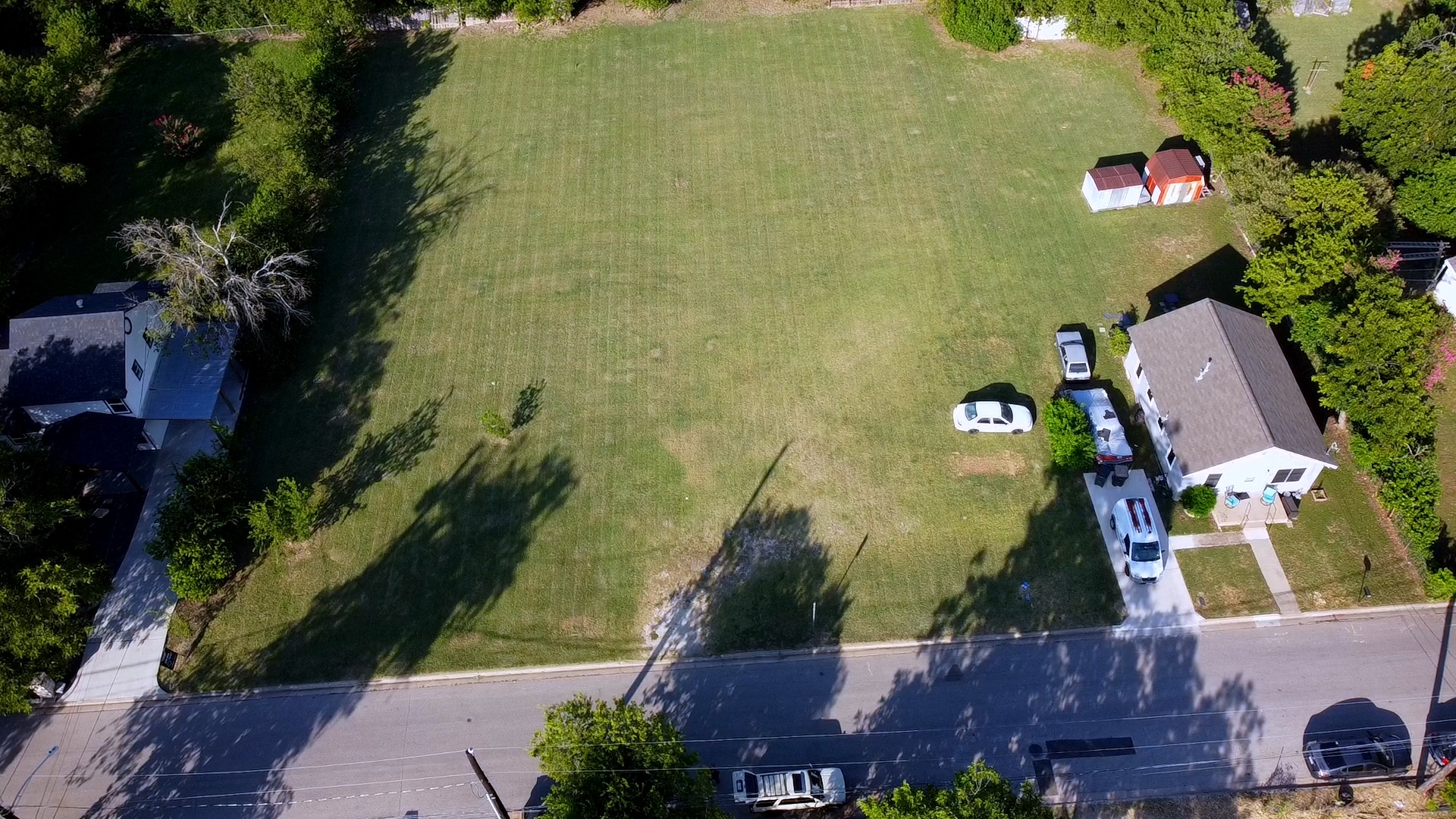 2005 Pine Street Georgetown, TX 78626 - Photo 6 of 7 A substantial grassy lot presents an ideal canvas for new construction in a residential setting.