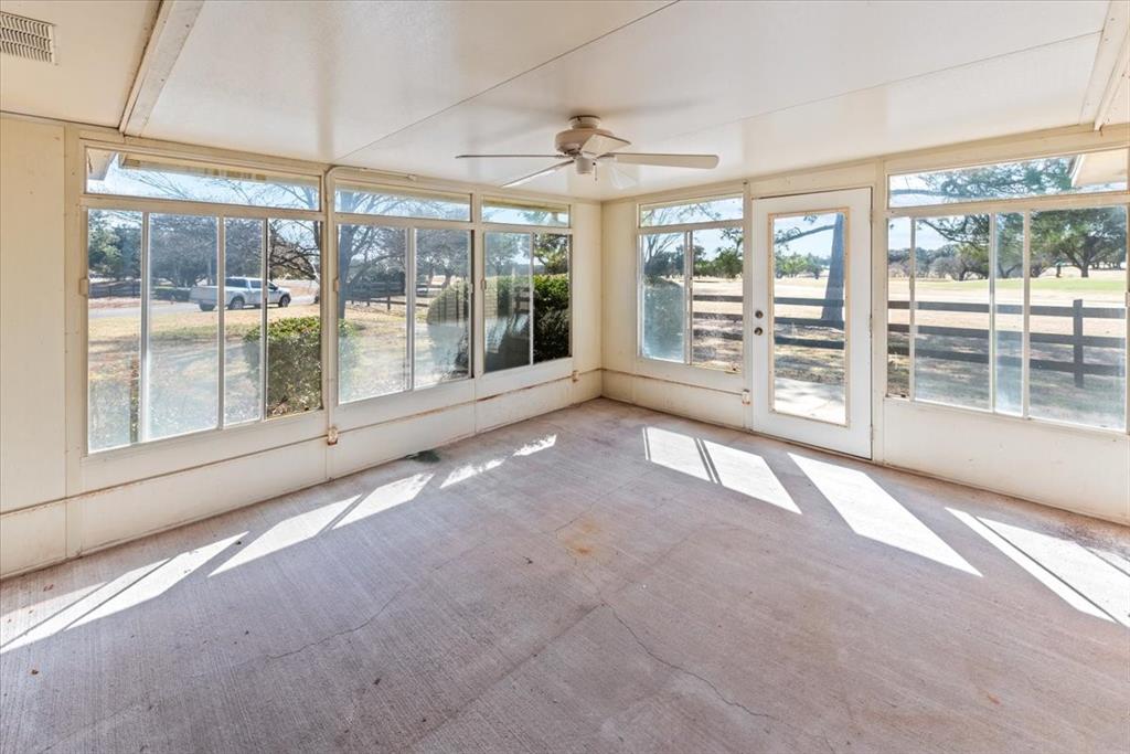9313 Tree Lake Drive Waco, TX 76708 - Photo 11 of 35 a view of an empty room with windows