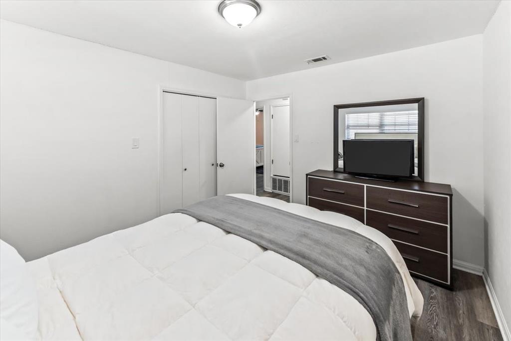 9313 Tree Lake Drive Waco, TX 76708 - Photo 15 of 35 a bedroom with a bed and a flat screen tv