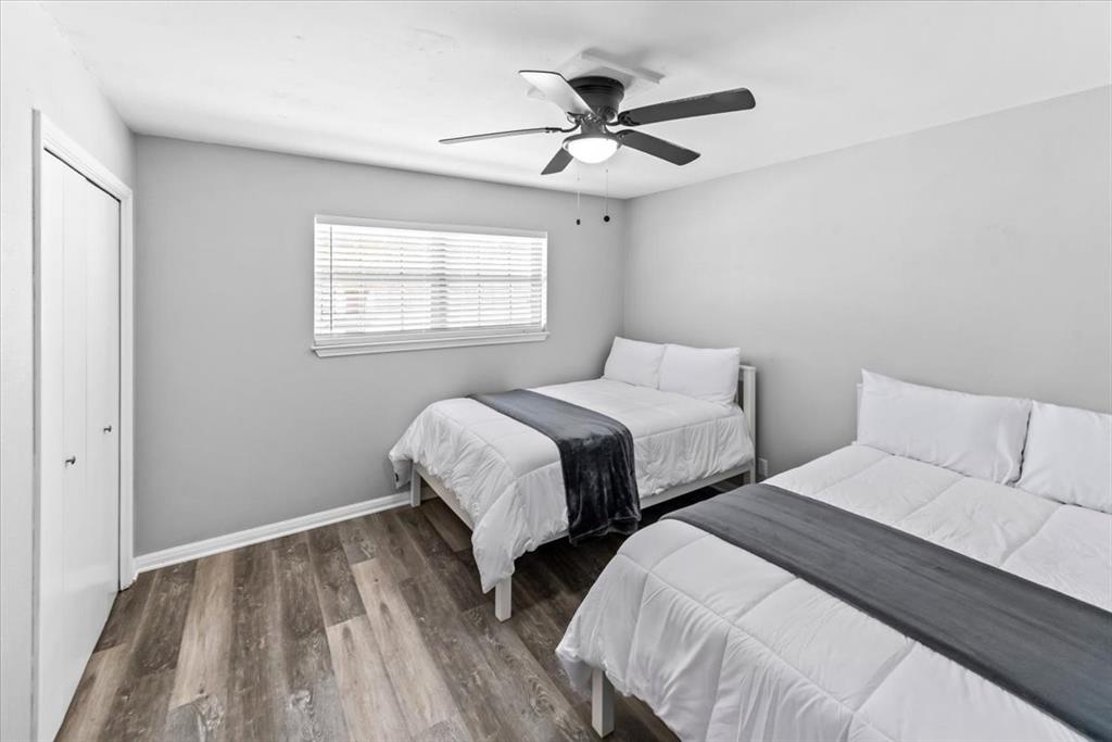 9313 Tree Lake Drive Waco, TX 76708 - Photo 19 of 35 a bedroom with two beds and a window