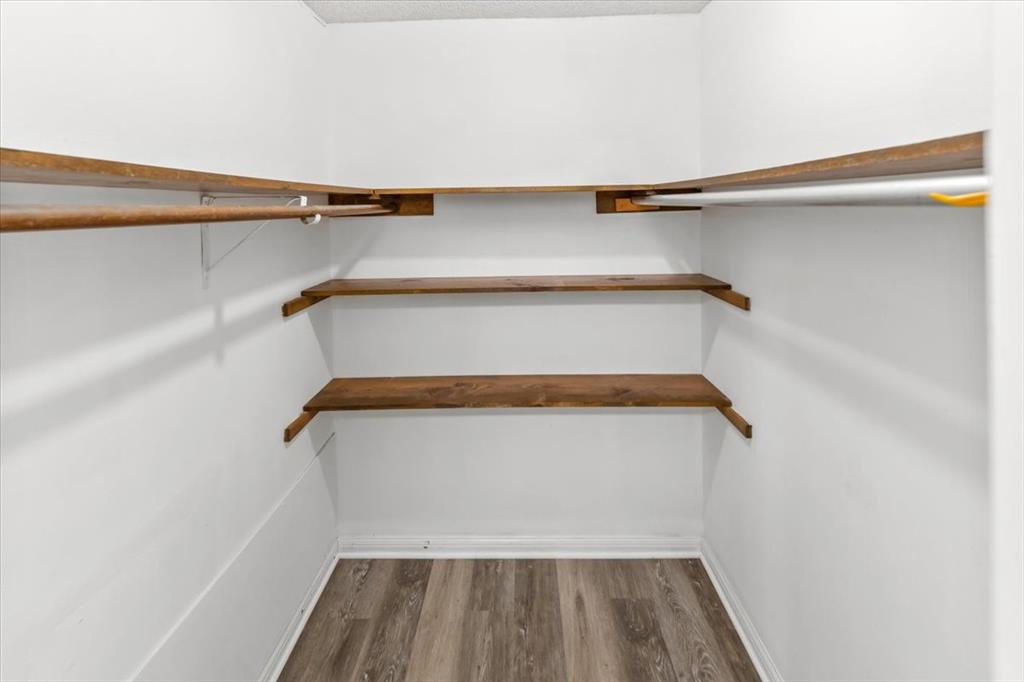 9313 Tree Lake Drive Waco, TX 76708 - Photo 20 of 35 a view of walk in closet with empty racks