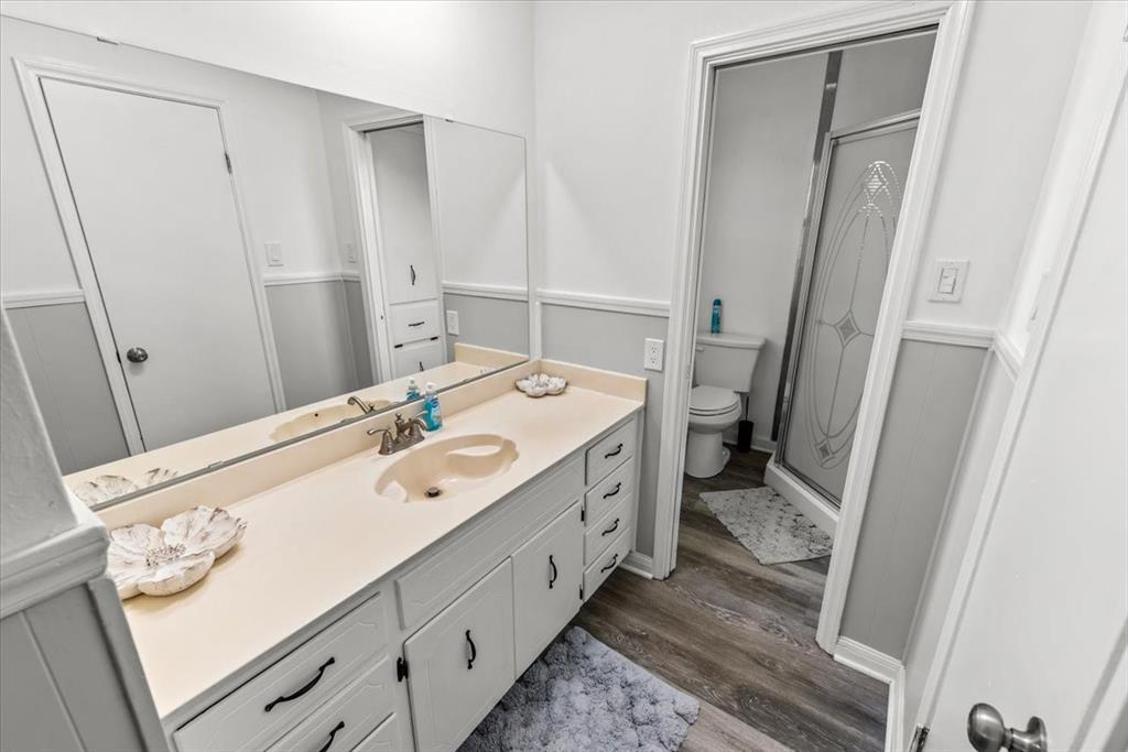 9313 Tree Lake Drive Waco, TX 76708 - Photo 22 of 35 a spacious bathroom with a double vanity sink and a mirror