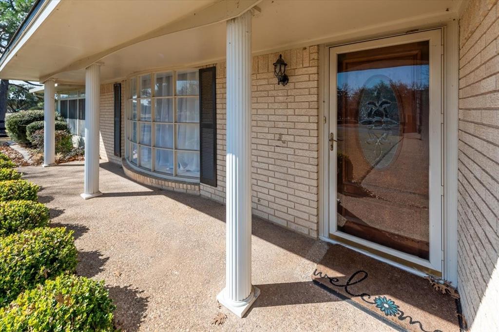 9313 Tree Lake Drive Waco, TX 76708 - Photo 5 of 35 a view of a backyard with a door and chair